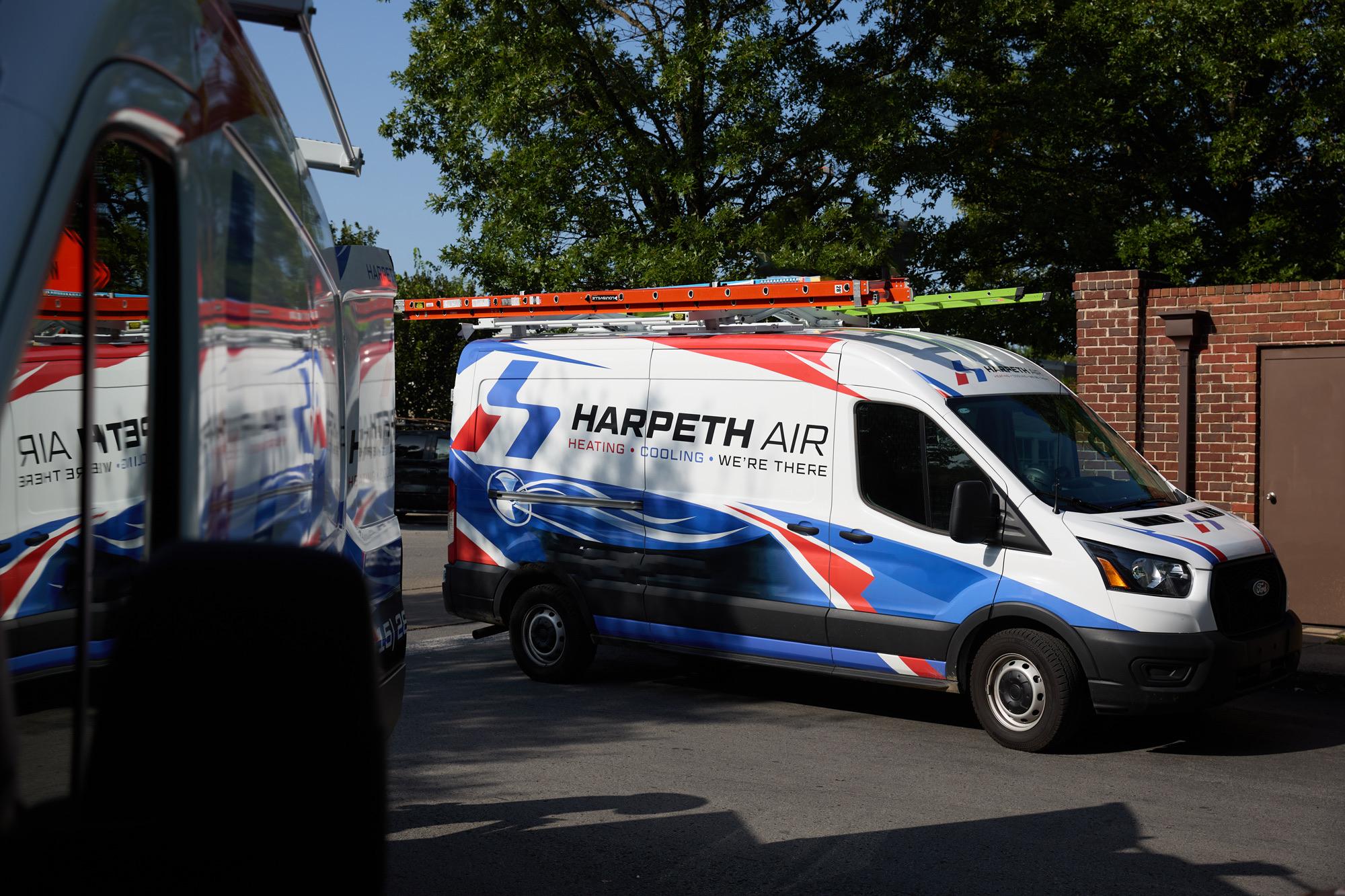 Harpeth Air service vans equipped with ladders